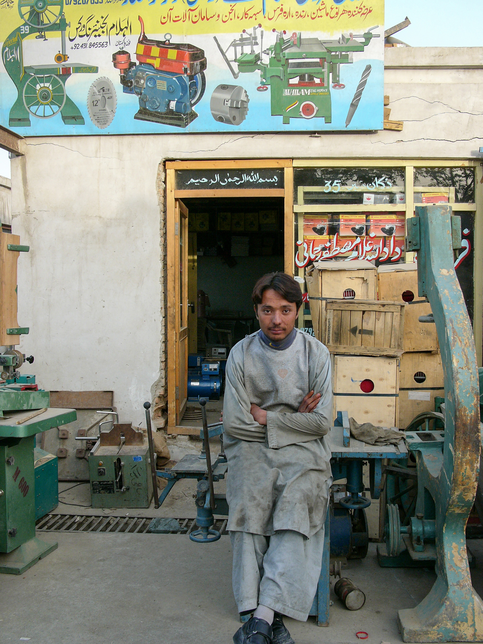 A young man working as a metal worker in Kabul, Afghanistan.
