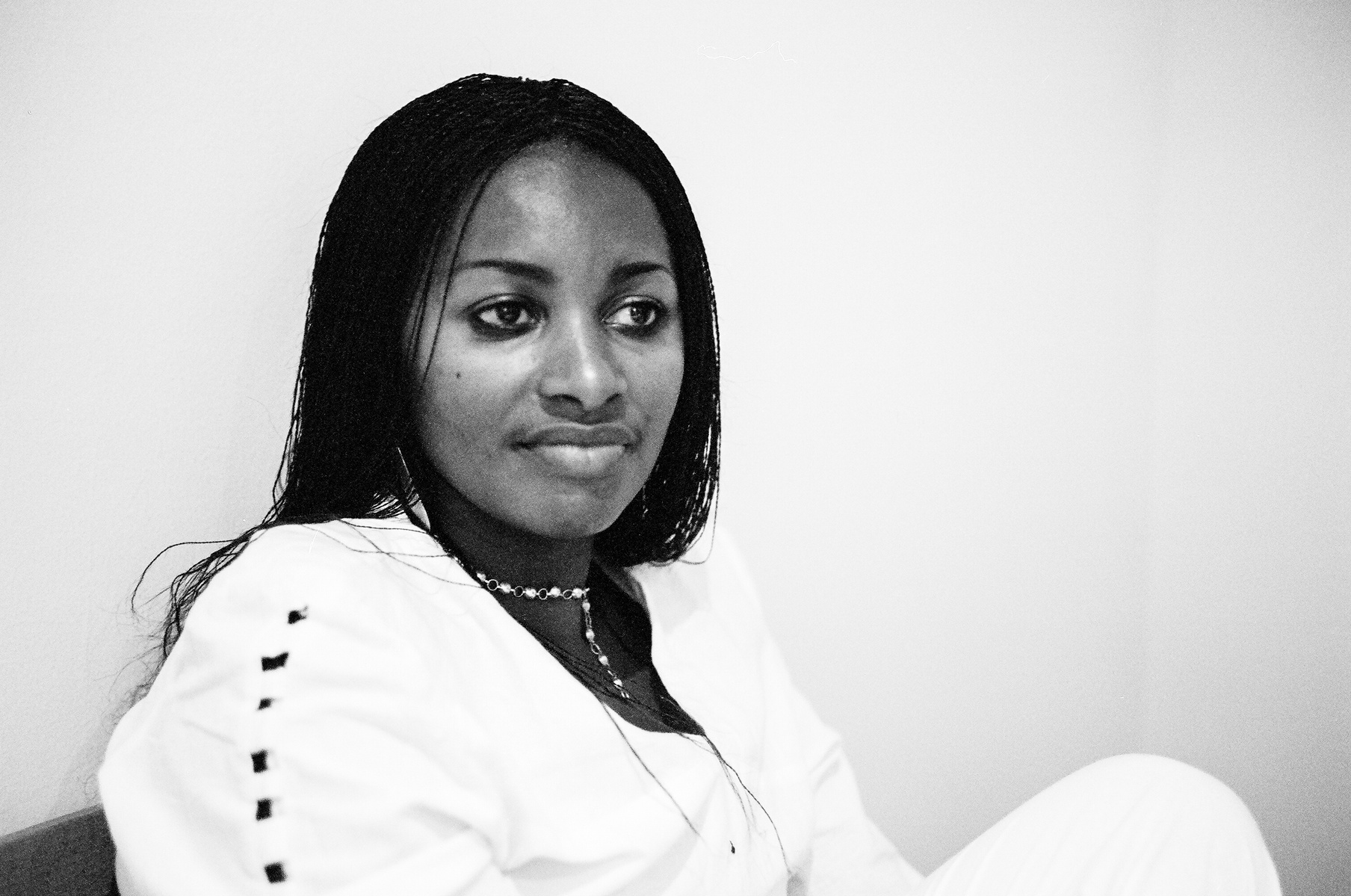 Black and white portrait of a woman from Rwanda, taken in Vienna, Austria.