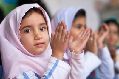 Colour portraits of children in festive clothing, photographed for UNICEF Iran in their kindergartens in West Azerbaijan, Iran.