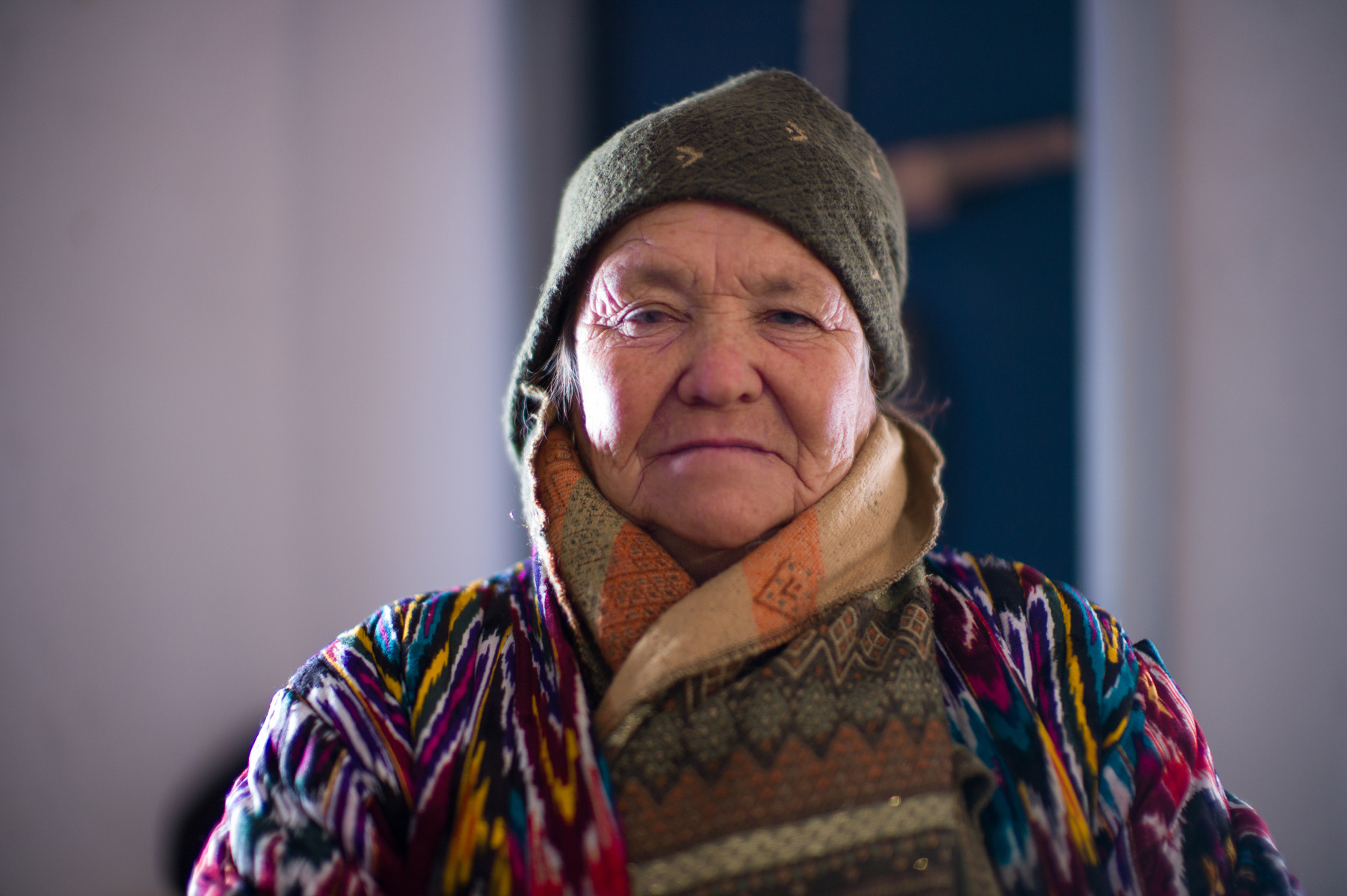 An Uzbek woman in traditional clothes, the gatekeeper of the former dungeons of Khiva, Uzbekistan.