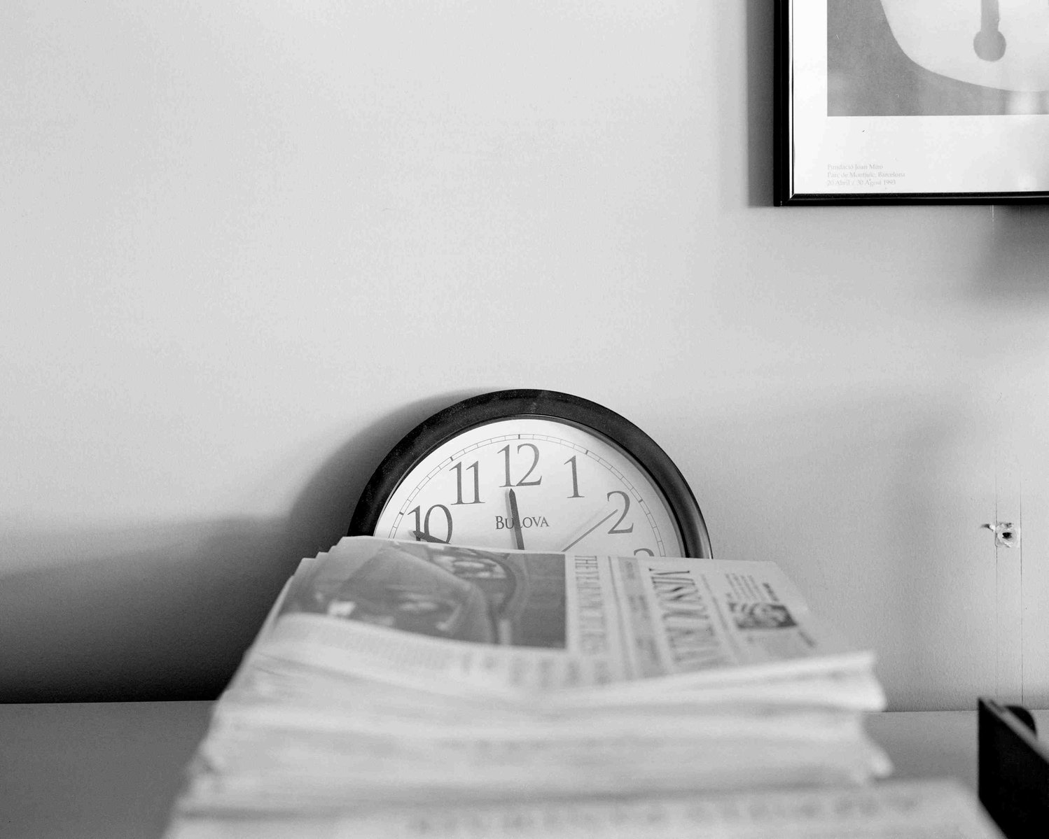 “I don’t think journalism is dying or can die. It can adapt, but it will always be there,” Marco, pictured in the previous photo, said. Here, a standstill clock rests in the dust behind a stack of newspapers in the Columbia Missourian newsroom. This room