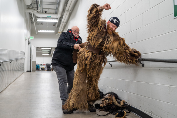 Mark LaCourse helps his son, Matt, into his Krampus outfit before Minnesota Krampus takes to the Christmas Market at Union Depot in St. Paul on Saturday, Dec. 8, 2018. Matt has been part of Minnesota Krampus for 4 years, but it is his father's first time