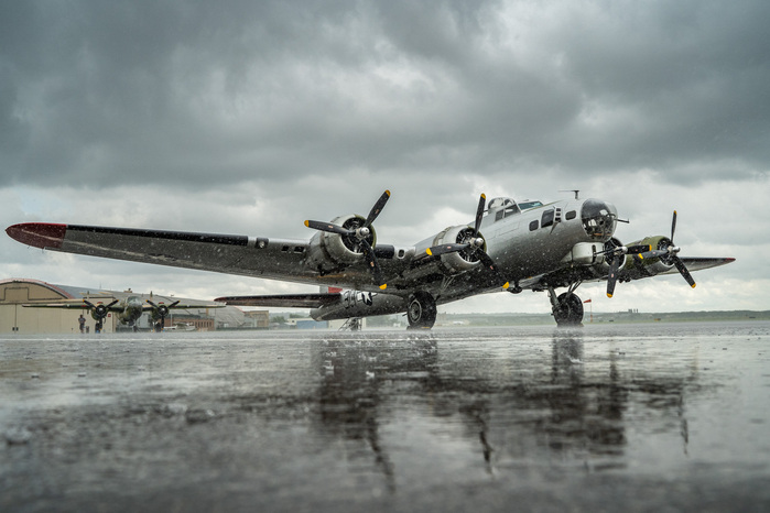 Rain comes down on a B-17G Flying Fortress, front, and a B-25 Mitchell at Holman Field at St. Paul Downtown Airport on Thursday, July 4, 2019. The B-17G has a gross weight of 65,500 pound when fully loaded.