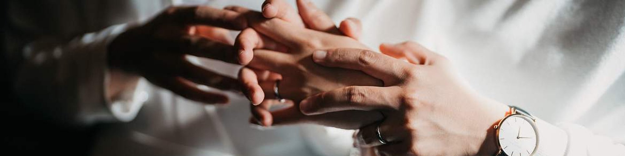 Close-up of a couple’s intertwined hands on their wedding day, capturing intimacy, emotion, and connection. Photographed by Chen Photography in Toronto.