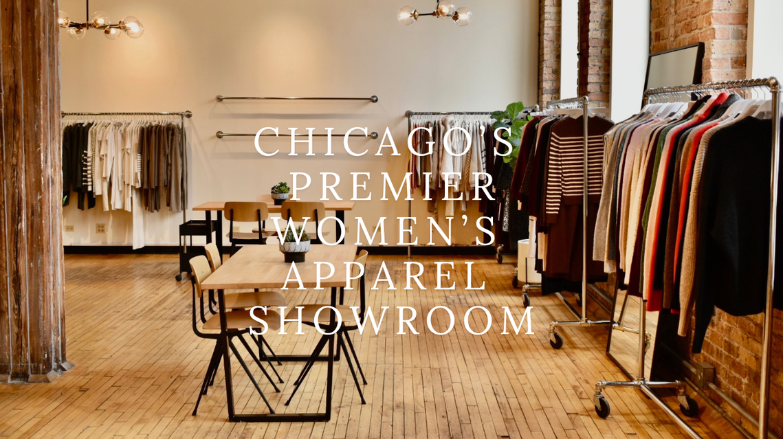 Interior of Pivet Showroom, Chicago's premier women's apparel showroom, featuring modern wooden floors, contemporary lighting, and curated racks of designer women's clothing in a stylish loft space.