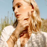 Jewelry on a girl in wildflowers