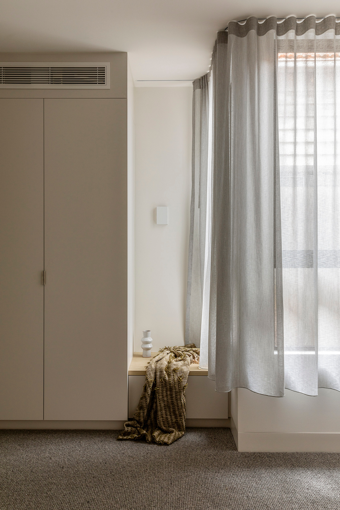 New bedroom robes with seat, corner window and soft translucent curtains