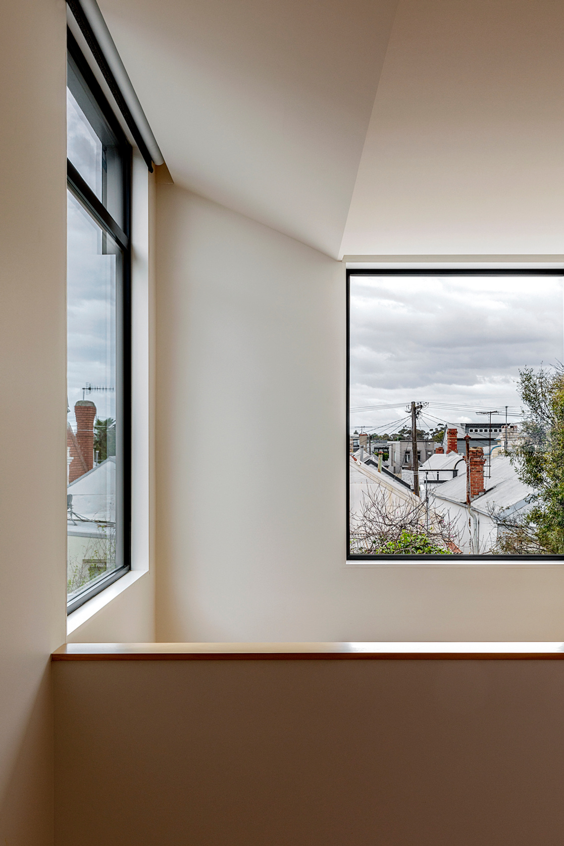 New double height space with long views over an urban sky and roof view