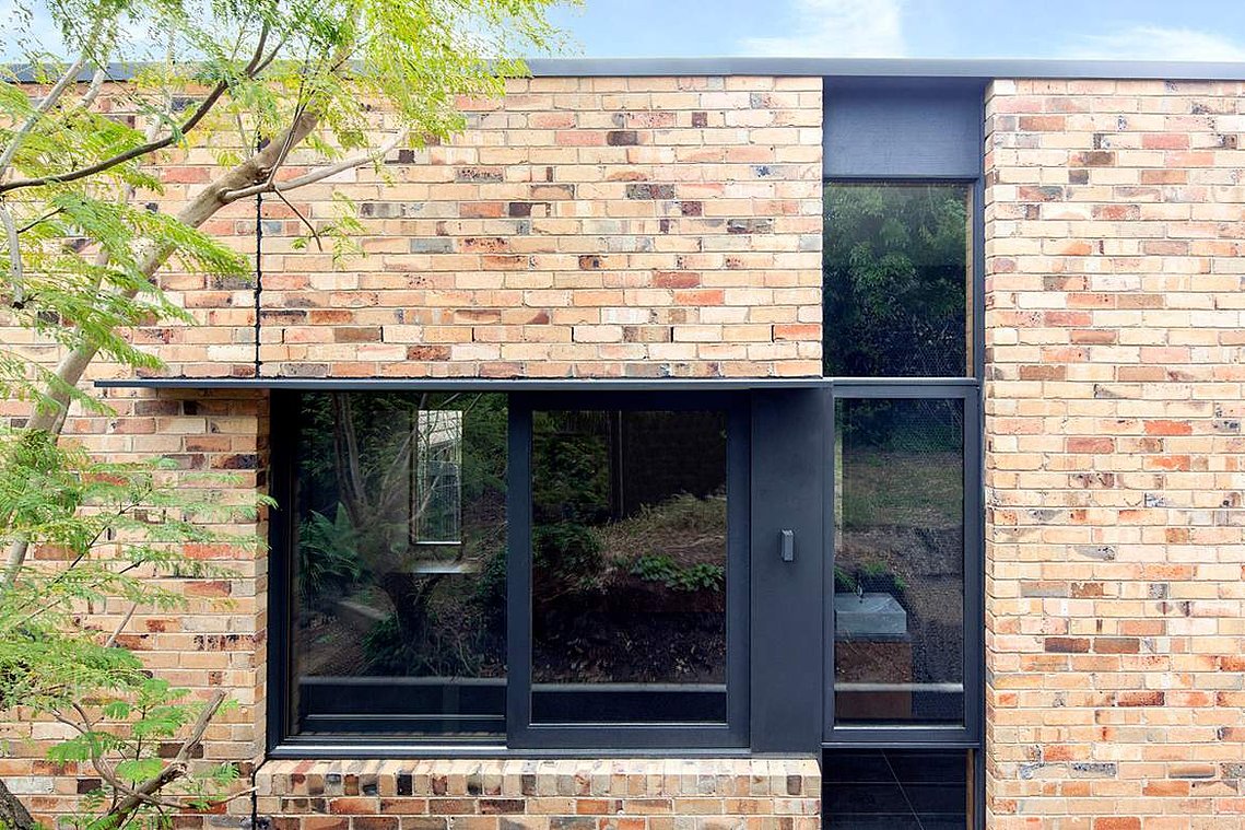 New recycled brick façade with black modern windows