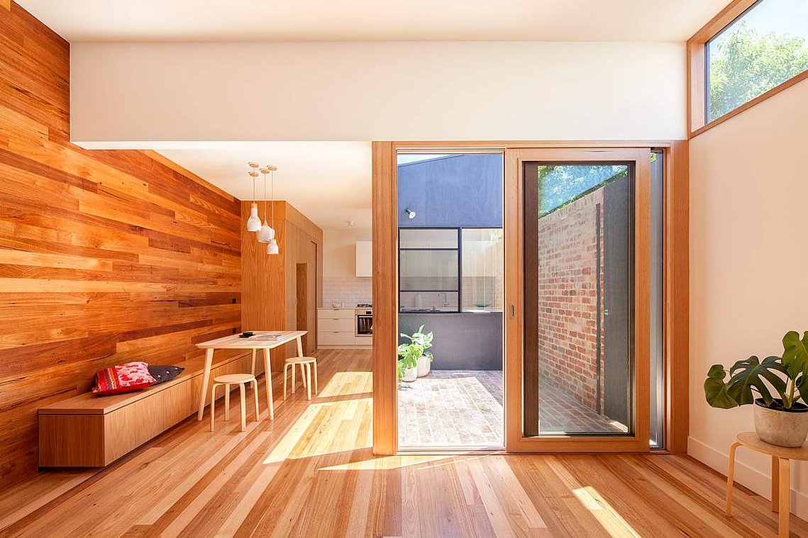 Modern home interior with timber floors and timber lined interior walls.