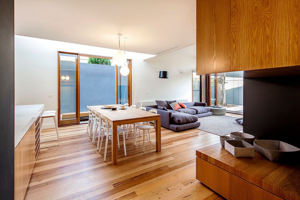 Kitchen dining living space with high level glazing void for sunlight throughout the day