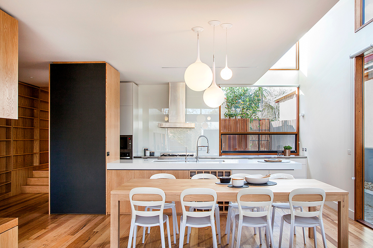 Kitchen dining living space with high level glazing for sunlight throughout the day