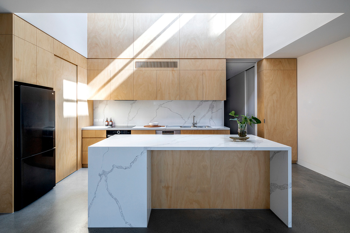 New plywood kitchen with double height space over