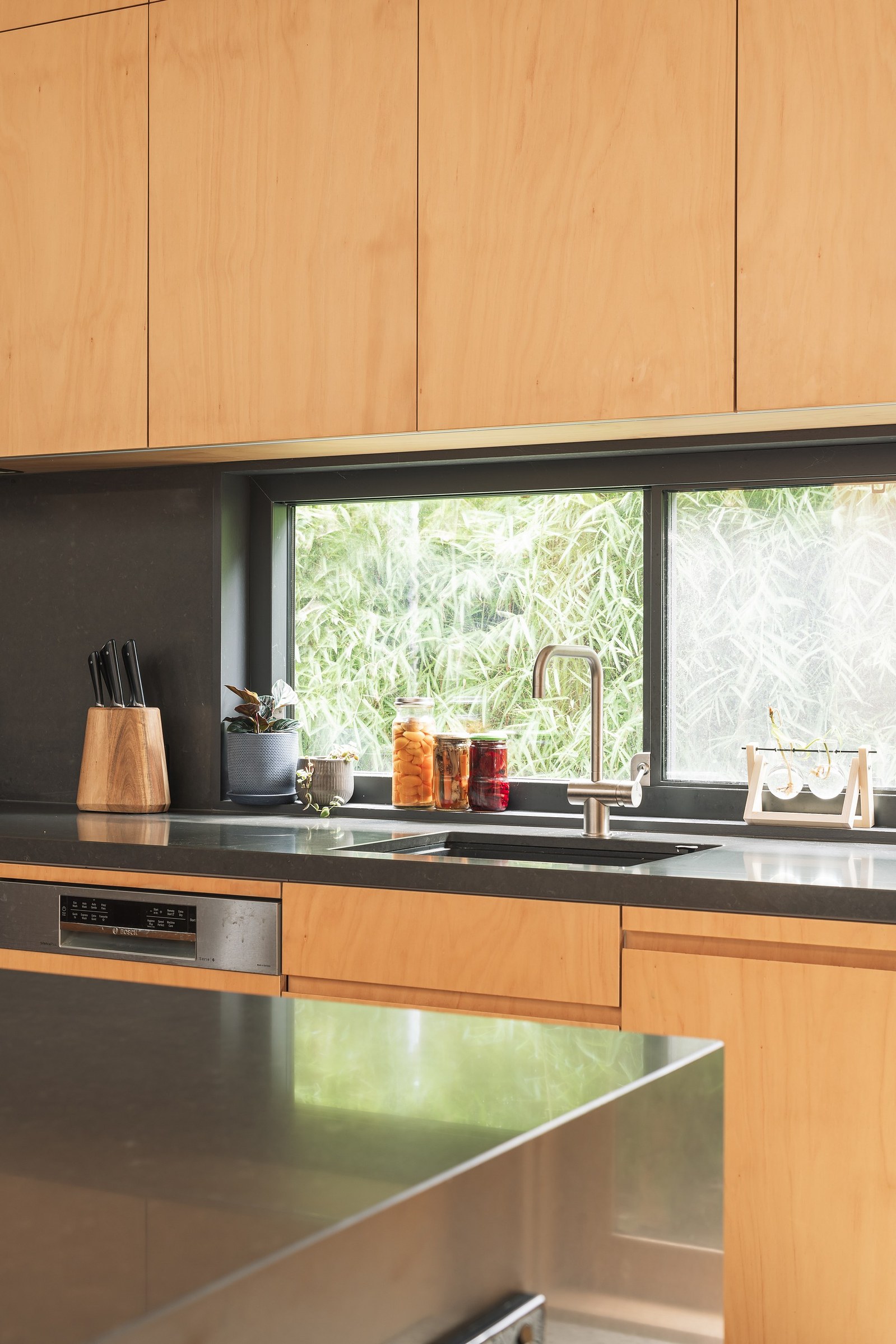 Kitchen window with island bench in foreground