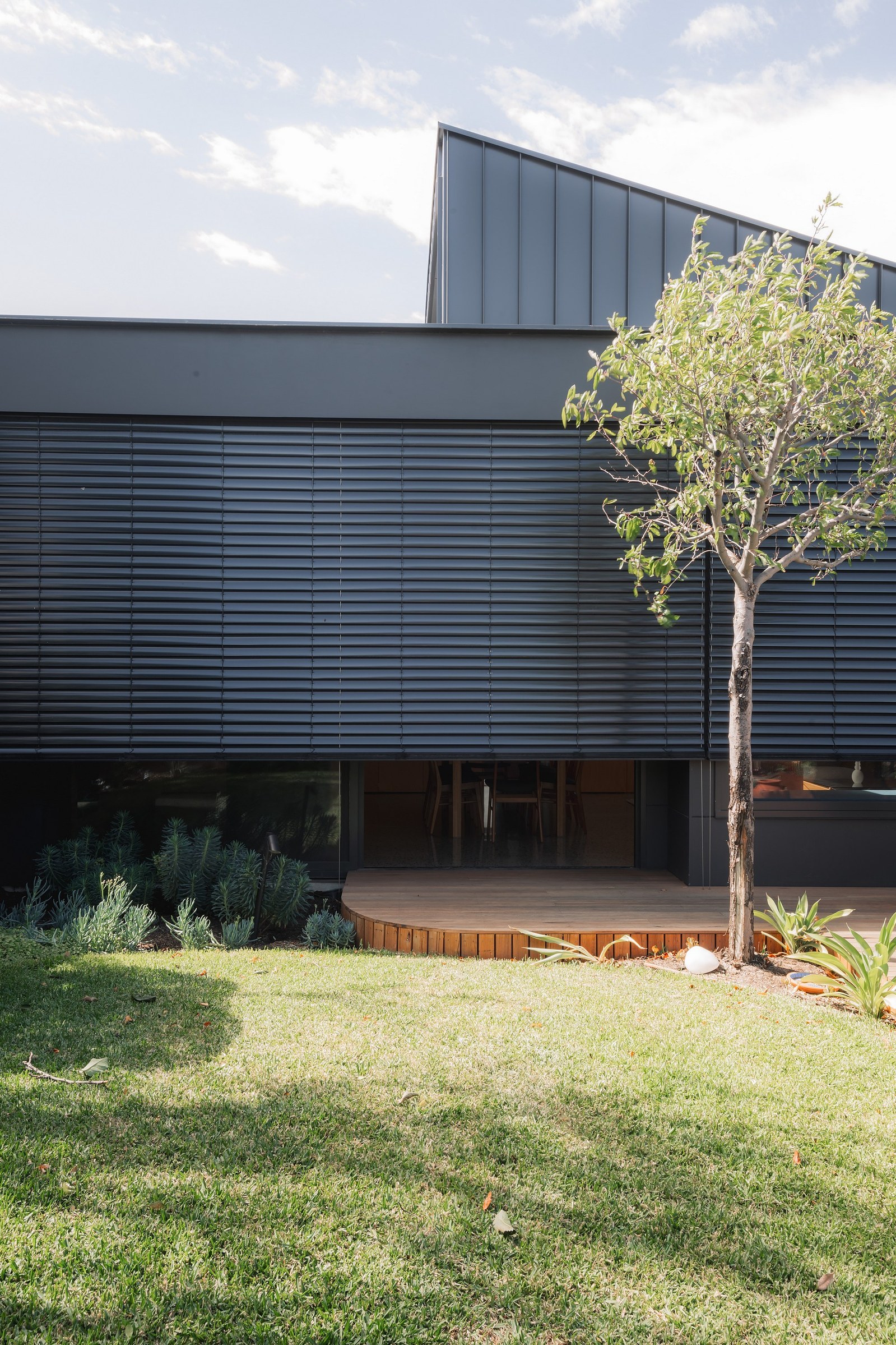 New building facade with mechanical blinds closing down