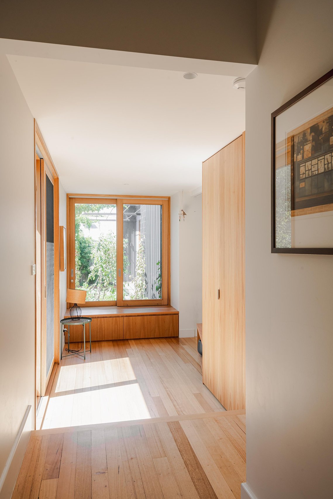 Sunny interior seat facing into a lush green garden. Sustainable living in Preston