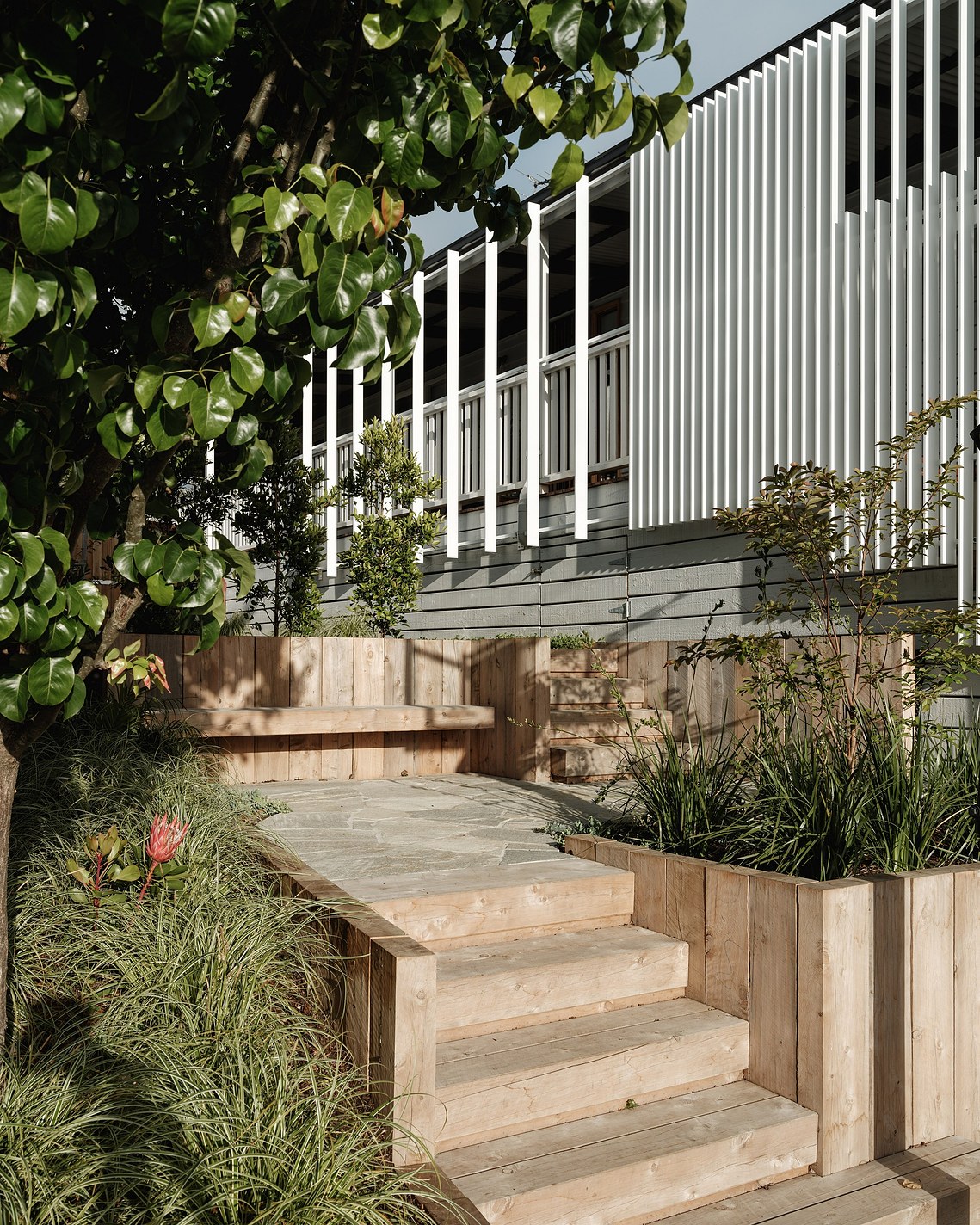 New landscape with decorative screen to existing building