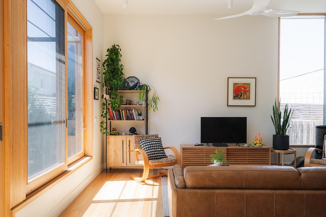 Sunny living space with comfortable chair. Sustainable living in Preston