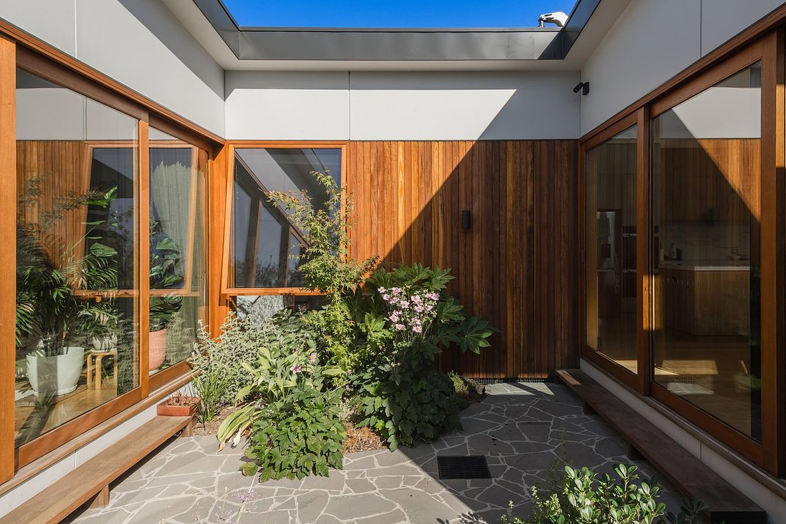 Central courtyard filled with light. Large glazed doors open out onto the space. 
Sustainable living in Brunswick