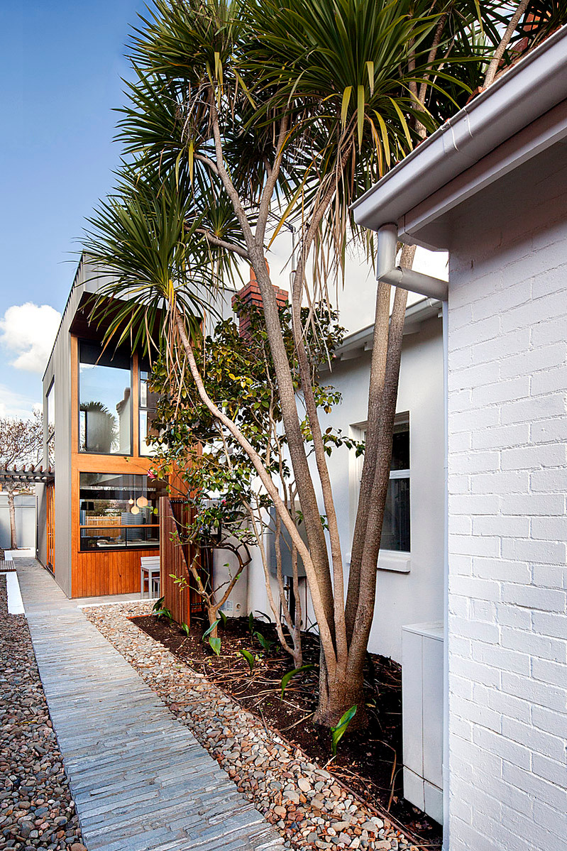 A new two storey building to the south of the existing building captures north light through highlight glazing