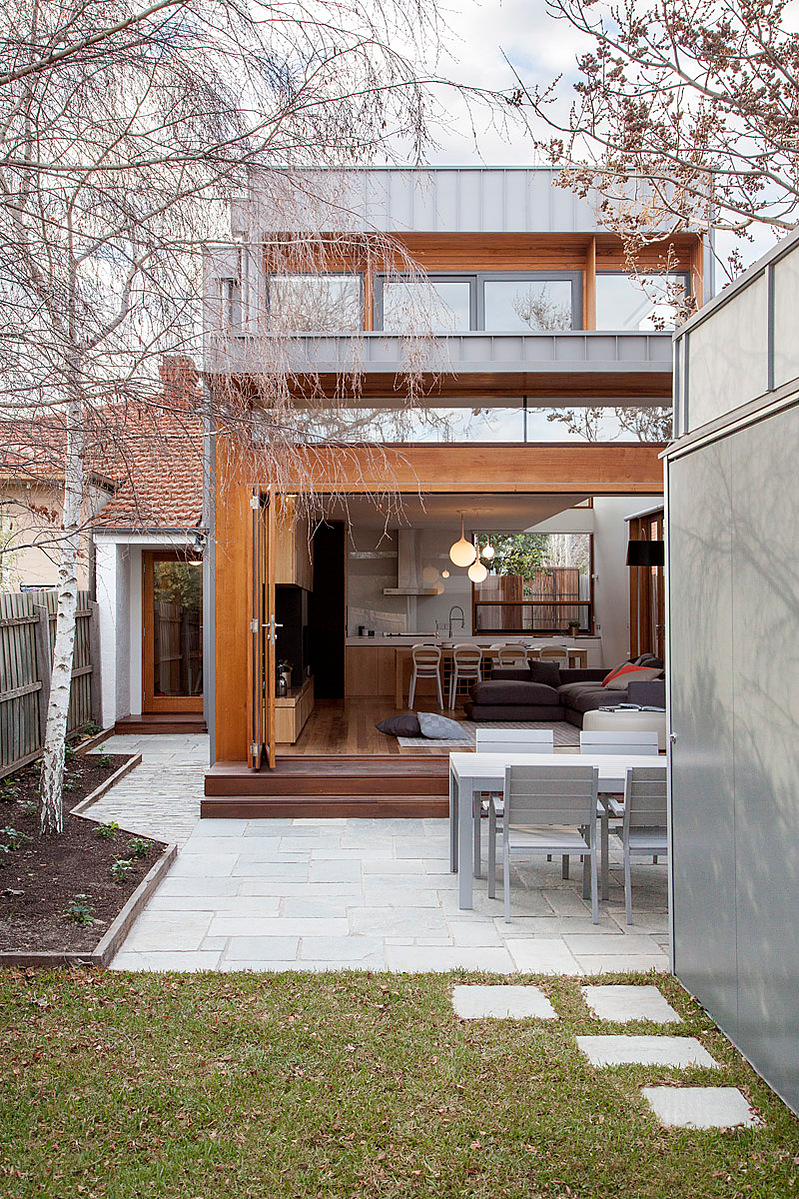 A new two storey building with a kitchen dining living space to the ground floor and access to the garden beyond