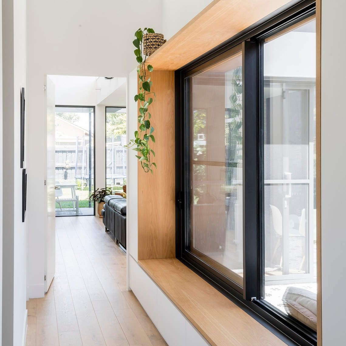 A timber lined window seat captures the sun and makes it an ideal place to enjoy reading a book in winter.
