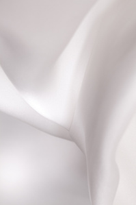 Soft fabric, white silk, high key. Looks like interweaving milky waves