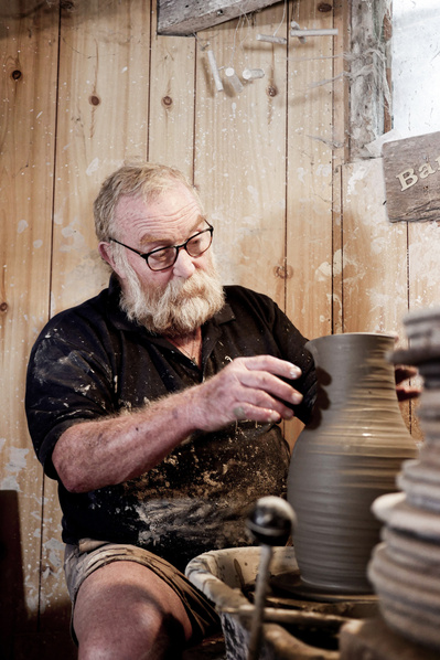 Barry Dorrity making pottery in his studio