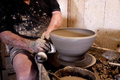 Barry Dorrity making handcrafted pots on the potter,s wheel