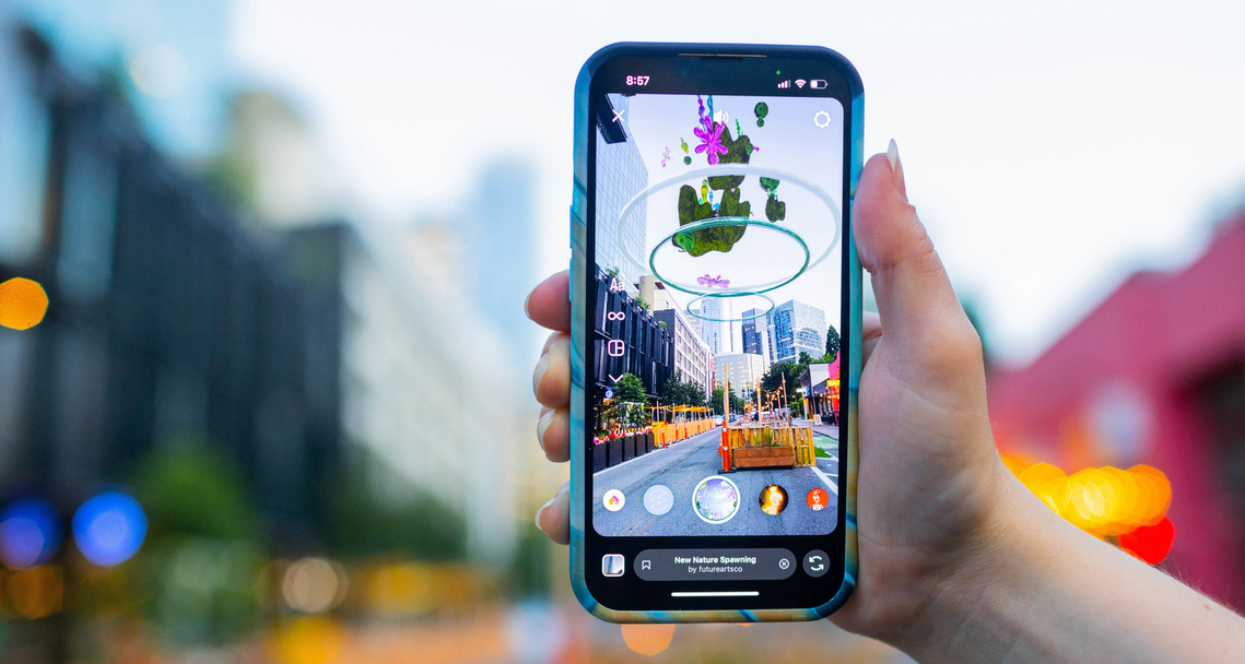 Mobile phone showing an Augmented Reality artwork by Nadine Kolodziey - entitled: New Nature Spawning, Photo Credit: Yuliya Bruk 