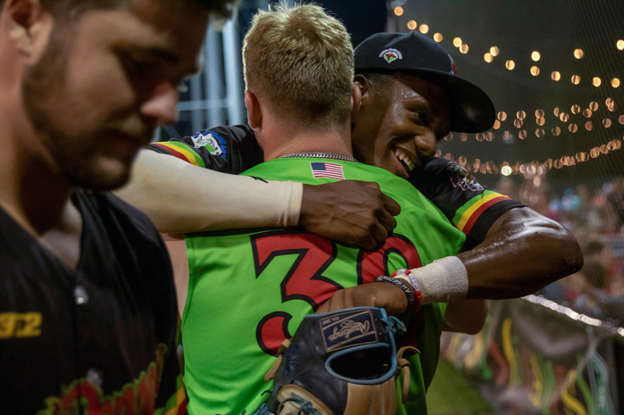 Tri-City Chili Peppers outfielder Michael Dolberry II hugs his teammate Avery Neaves after being substituted out of the fifth inning of the final regular season game at Shepherd Stadium on August 5, 2023.