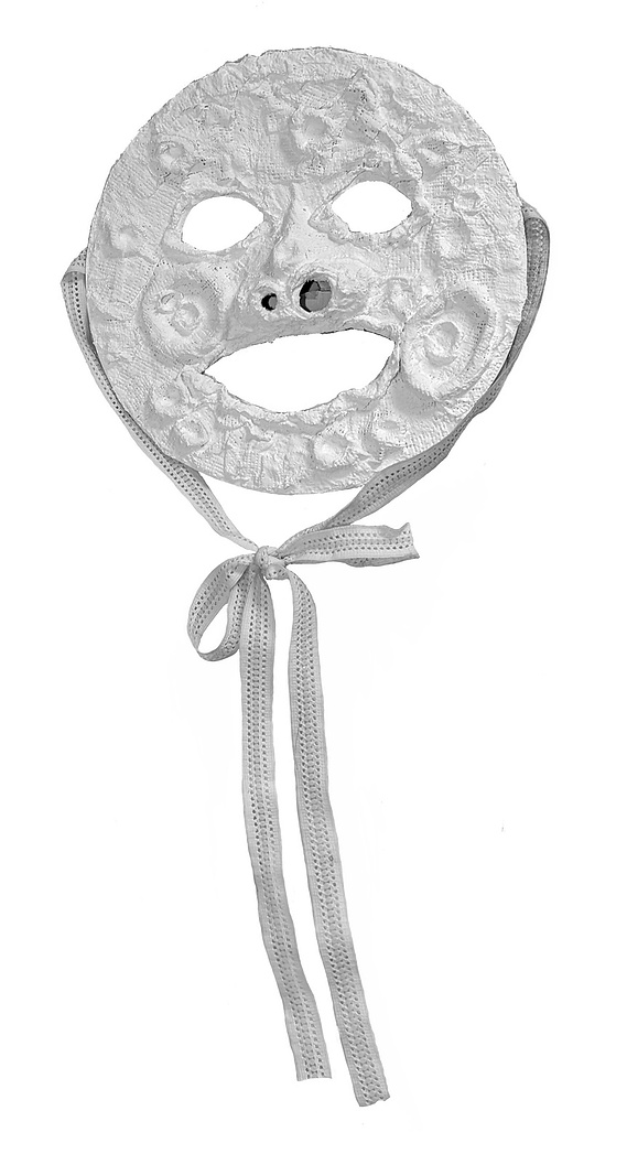 The moon mask made with modroc and a paper plate.