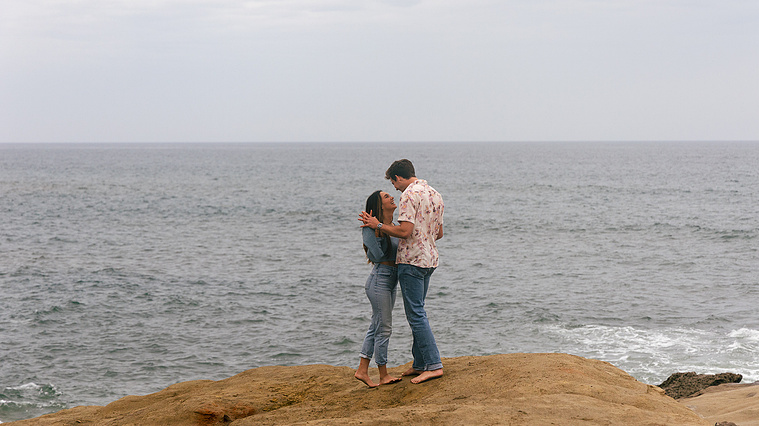 Couple holding each other at Sunset Cliffs in San Diego