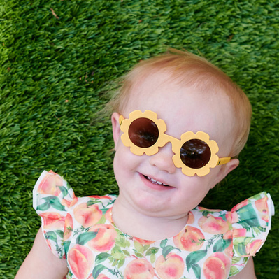 Baby wearing babiator sunglasses, commercial lifestyle shoot for Babiators brand.