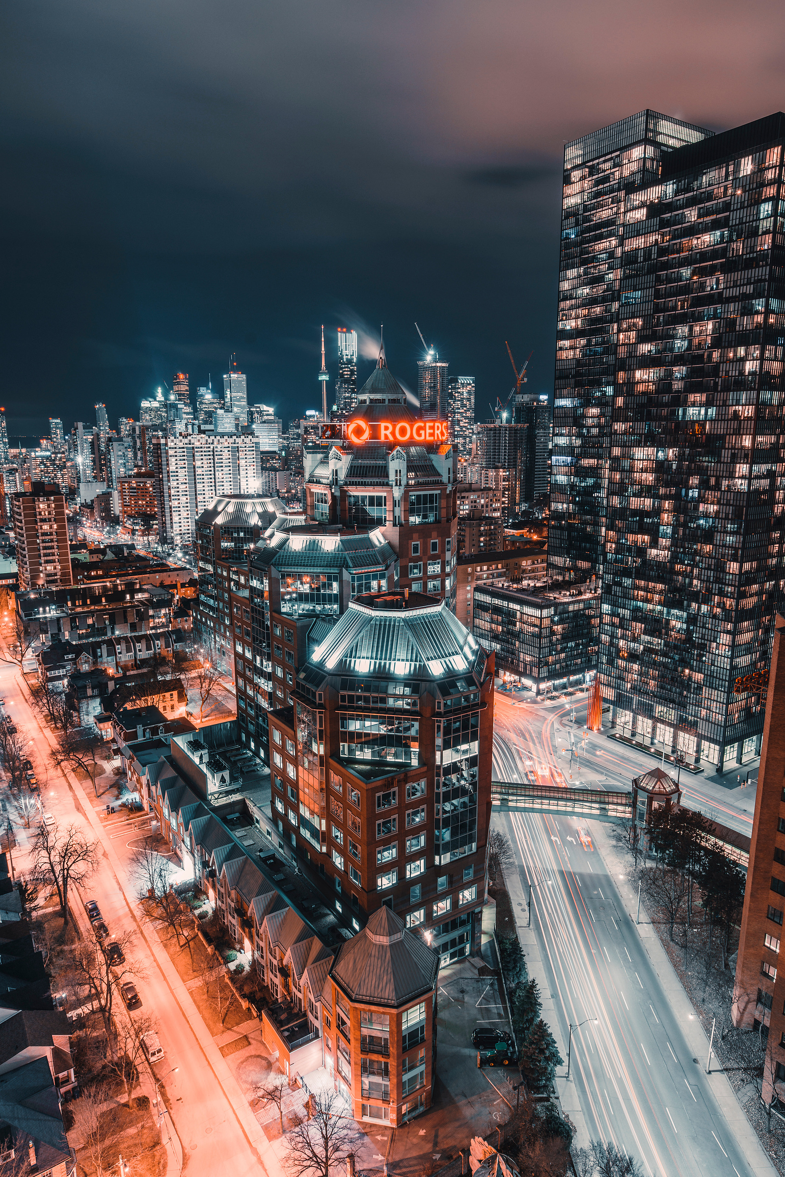 View of the Rogers building and the Toronto skyline from a rooftop at night