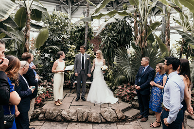 A wedding scene at Allan Gardens arboretum.