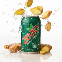 Image of Zevia Ginger Ale Zero Calorie Soda with real ginger and splashing liquid in dynamic composition photographed by commercial photographer Jason Barnes