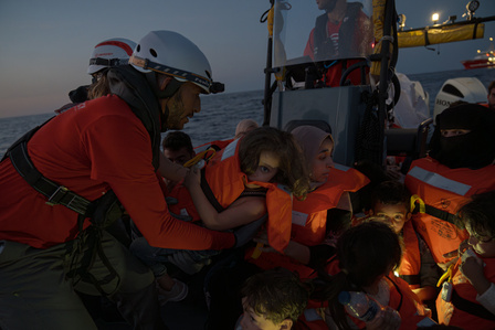 Emergency's Search and Rescue (SAR) crew rescuing a distressed boat with 76 people, including women and children, in the Mediterranean off the Libyan coast. 