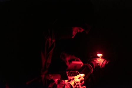 An activist collects SD memory cards from a hidden camera inside a large-scale meat company. The videos they record during night missions, undercover investigations, or hidden cameras serve to educate people about the real life animals endure in factories