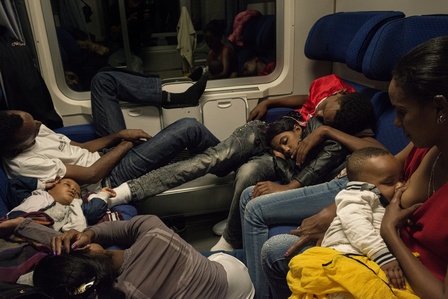 A group of migrants from Somalia, Eritrea, and Sudan travels in a carriage of the Intercity night-train from Rome to the Austrian border. 