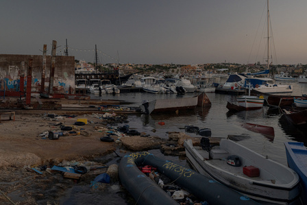 Migrants boats that reach Lampedusa island, whether independently or towed by rescuers, are left to accumulate in the Favarolo harbour and eventually break up, scattering debris in bad weather.