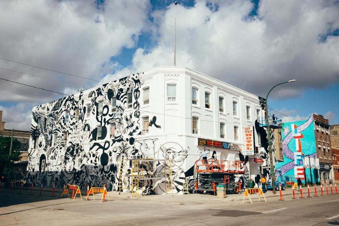 EN MASSE mural on New West Hotel in Winnipeg, Manitoba