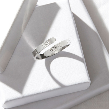 Remote jewellery photographer, modernist silver ring on white boxes with shadows