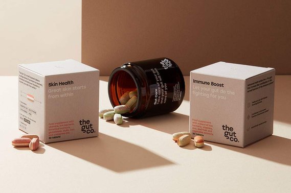 Supplements product photography.  Jar with tablets spilling out on a neutral background