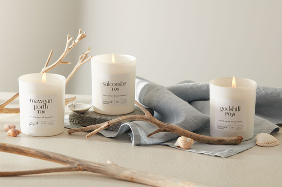  Candle product photography Coastal styling with driftwood and shells