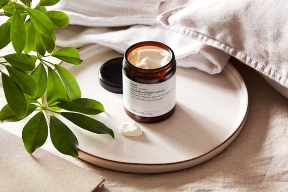 Lifetstyle product photography of skincare products on the bedside