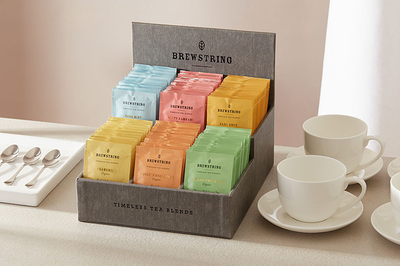 Large-Tea-Presenter shown with cups and teaspoons on a neutral background with daylight shadows