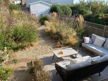 The studio garden with outdoor sofa and flowers
