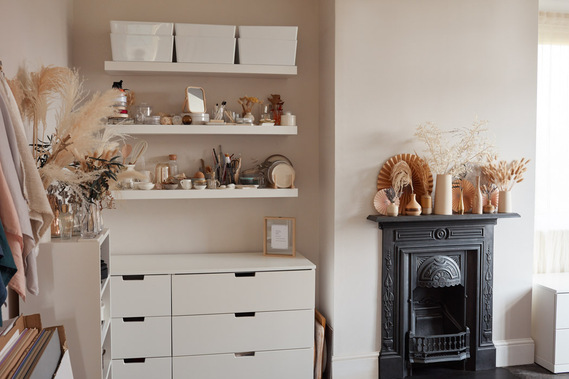 Product photography studio with props and a Victorian cast iron fireplace