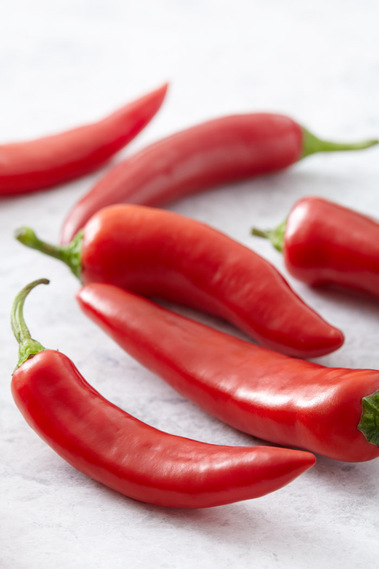 Fresh res chillies on a stone background
